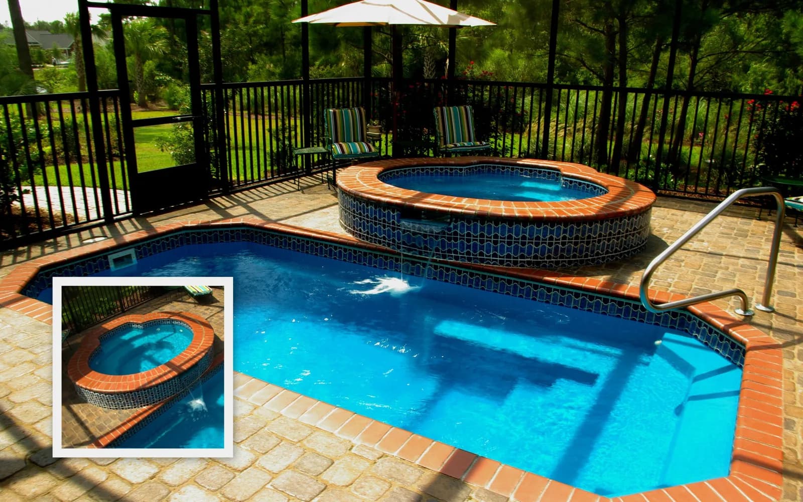 Pool with raised spillover spa finished in stone