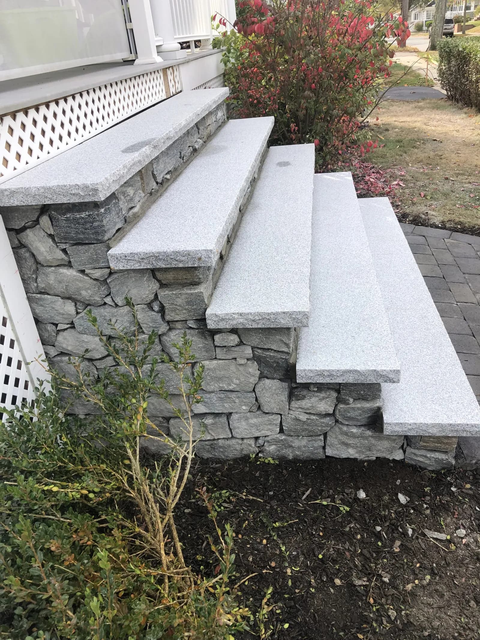 Granite steps and natural fieldstone masonry by Flynn